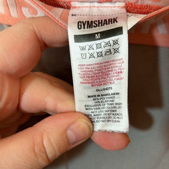Size medium gymshark, gray seamless leggings with peach band - Picture 4 of 6